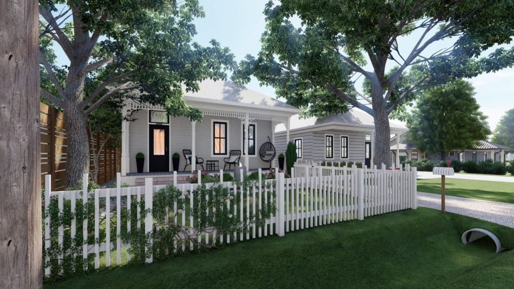 姜饼风格的门廊和草坪前院包含一个白色乙烯基水平柱栅栏