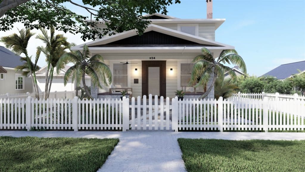 平房风格的家有盖的前廊与休息室座位和门廊风扇，棕榈树在前院，和白色尖桩栅栏